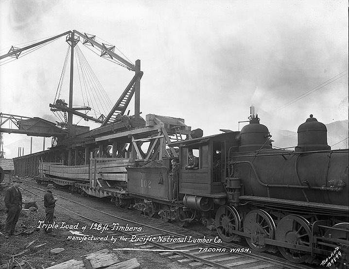 #82 Triple load of 128 ft. timbers, manufactured by the Pacific National Lumber Co., Tacoma, 1924