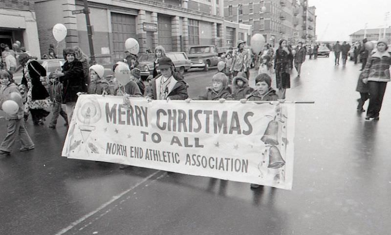 #17 Children with North End Athletic Association banner march in North End Christmas Parade