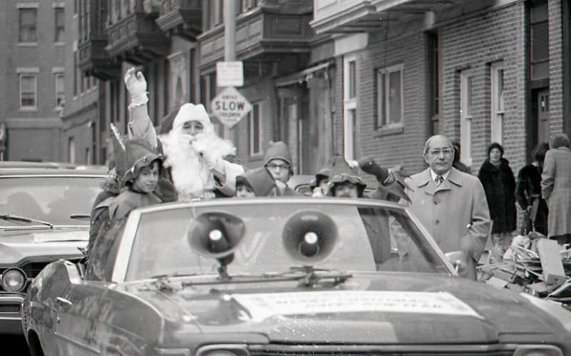 #22 Santa Claus in car with children dressed as elves at North End Christmas Party and Parade
