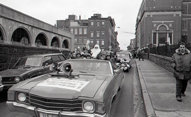 #34 Santa Claus in car with children dressed as elves in North End Christmas Parade