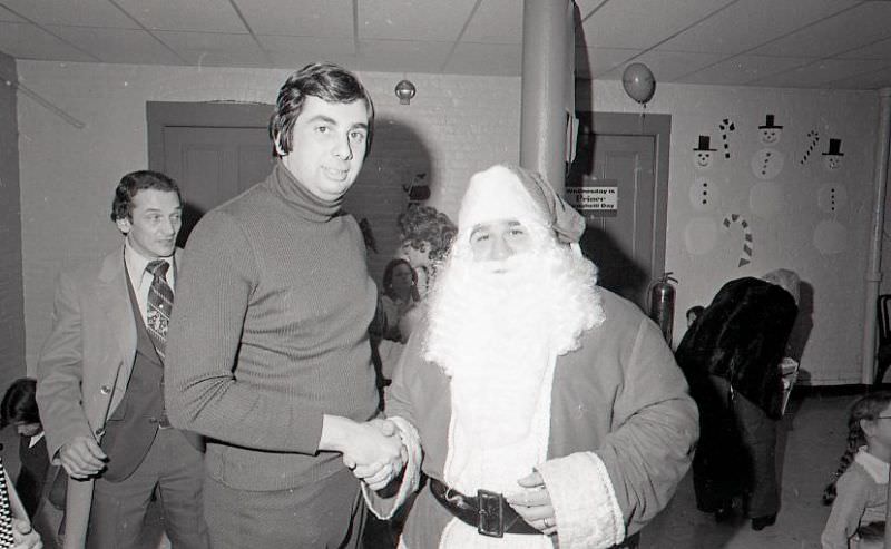 #44 Man with Santa Claus at North End Christmas Party
