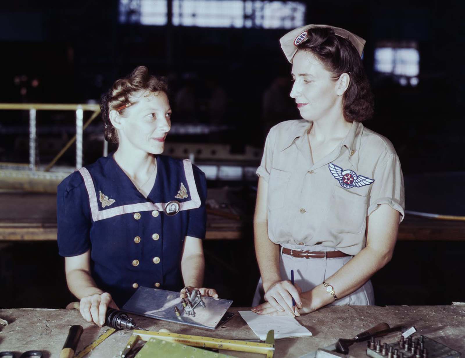 #13 Virginia Young, right, a Pearl Harbor widow, is a supervisor in the Assembly and Repairs Department of the Naval Air Base.