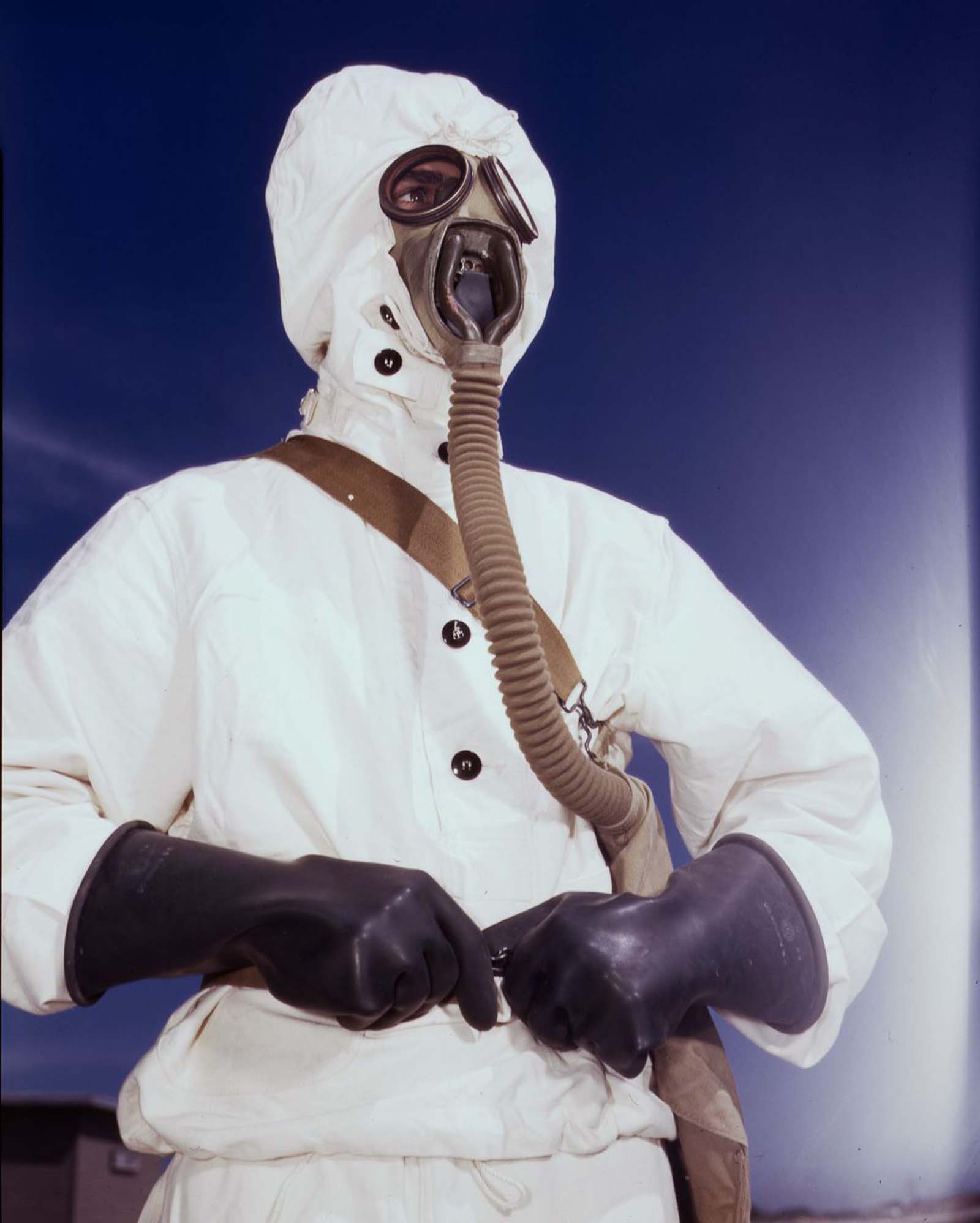 #3 A sailor tries on a new type of protective clothing and gas mask for use in chemical warfare.