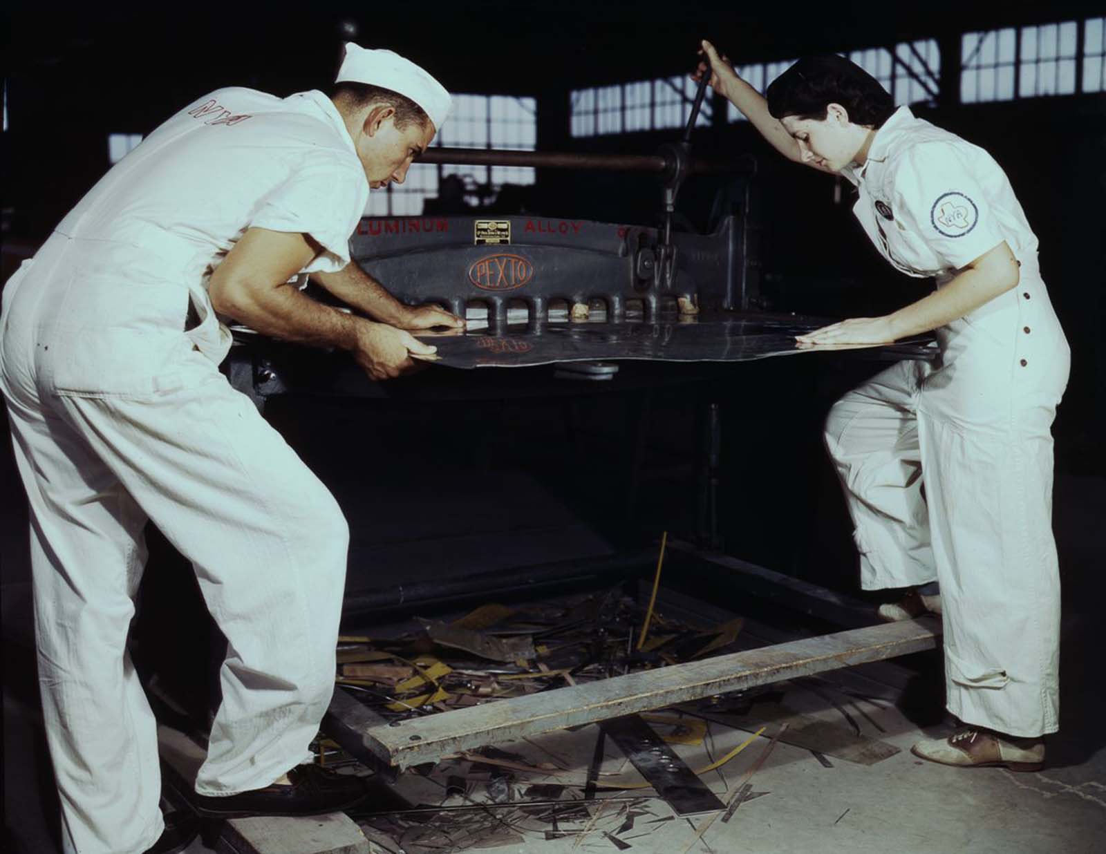 #7 Learning to work a cutting machine, two NYA employees receive training to fit them for important work.