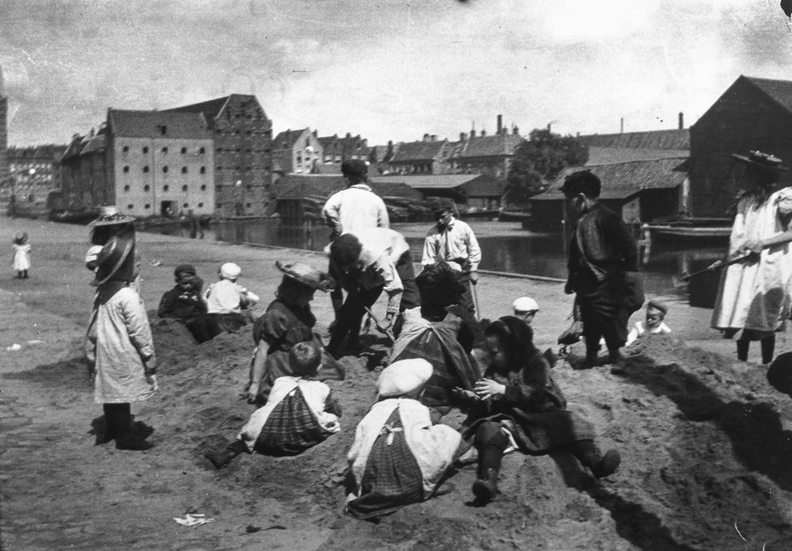 #12 Children play in a sand dump near Prince Island.