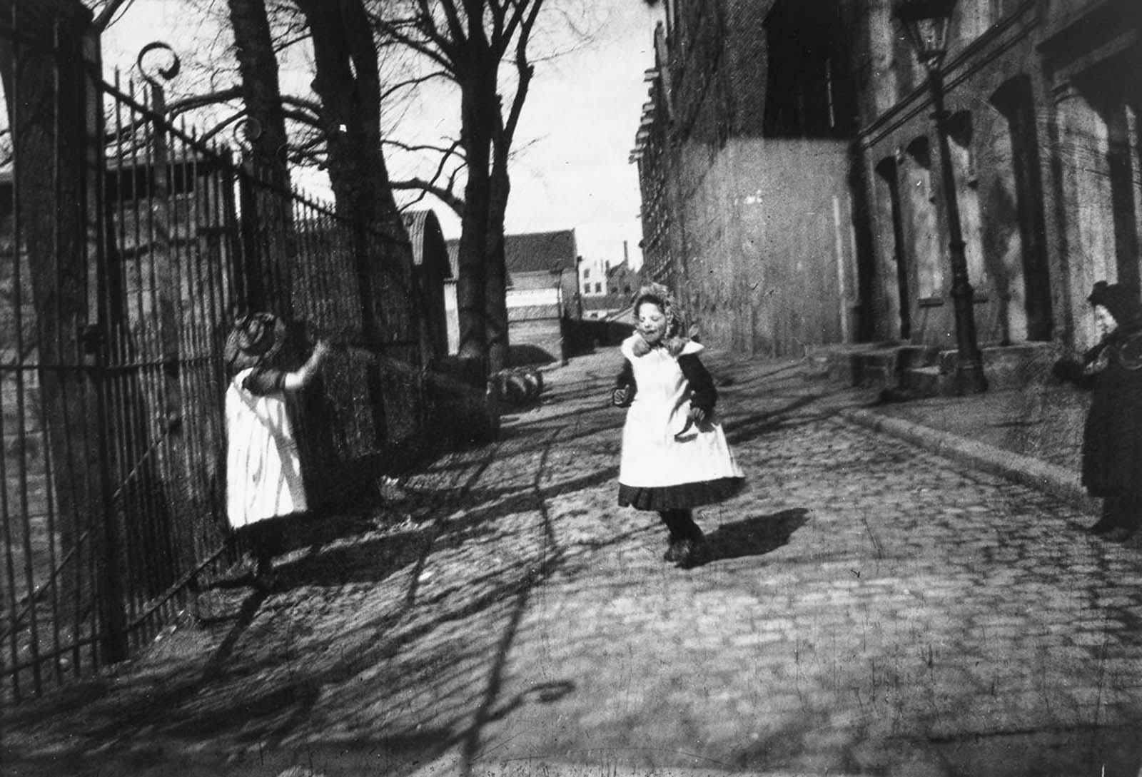 #19 Children play near the entrance to Breitner’s studio on Prince Island.