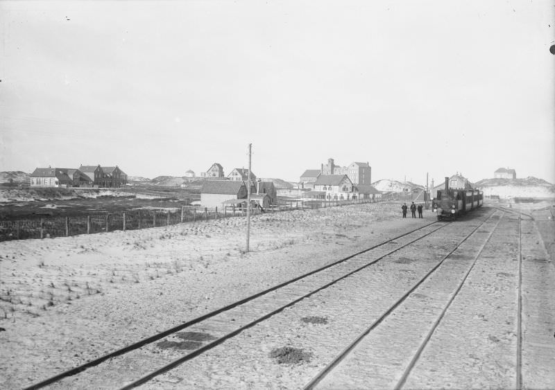 #18 The station yard of Bergen aan Zee, with a steam tram ready for departure, seen to the west.