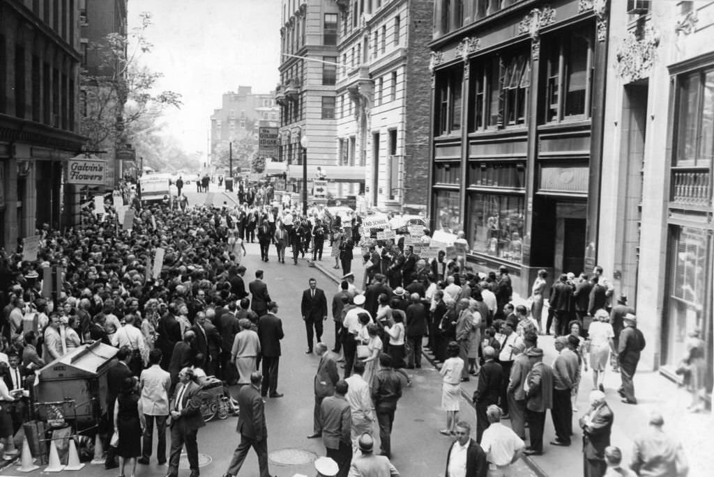 #98 Roughly 1,000 delegates to the Unitarian Universalist General Assembly in session in Boston gather in silent vigil outside the office of the Boston School Committee on May 25, 1965.
