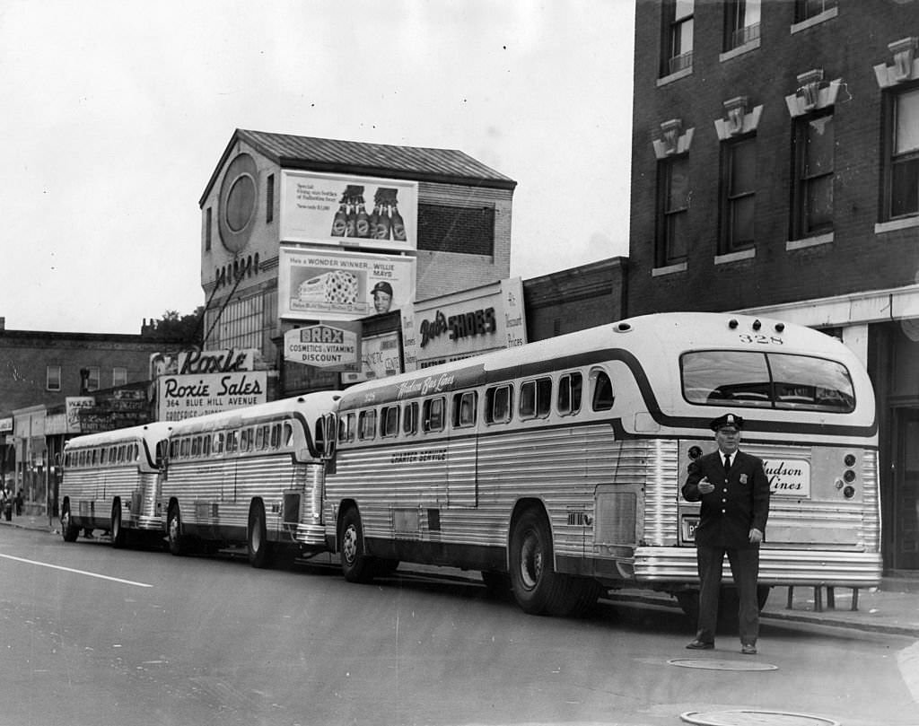 #101 Buses are lined up in front of 366 Blue Hill Ave. in Boston to take children to schools outside their districts in Boston on Sept. 13, 1965.