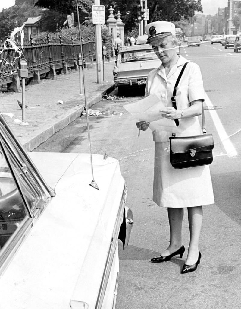 #116 Meter maid Mary Martin makes her rounds in Boston on Jul. 7, 1966.