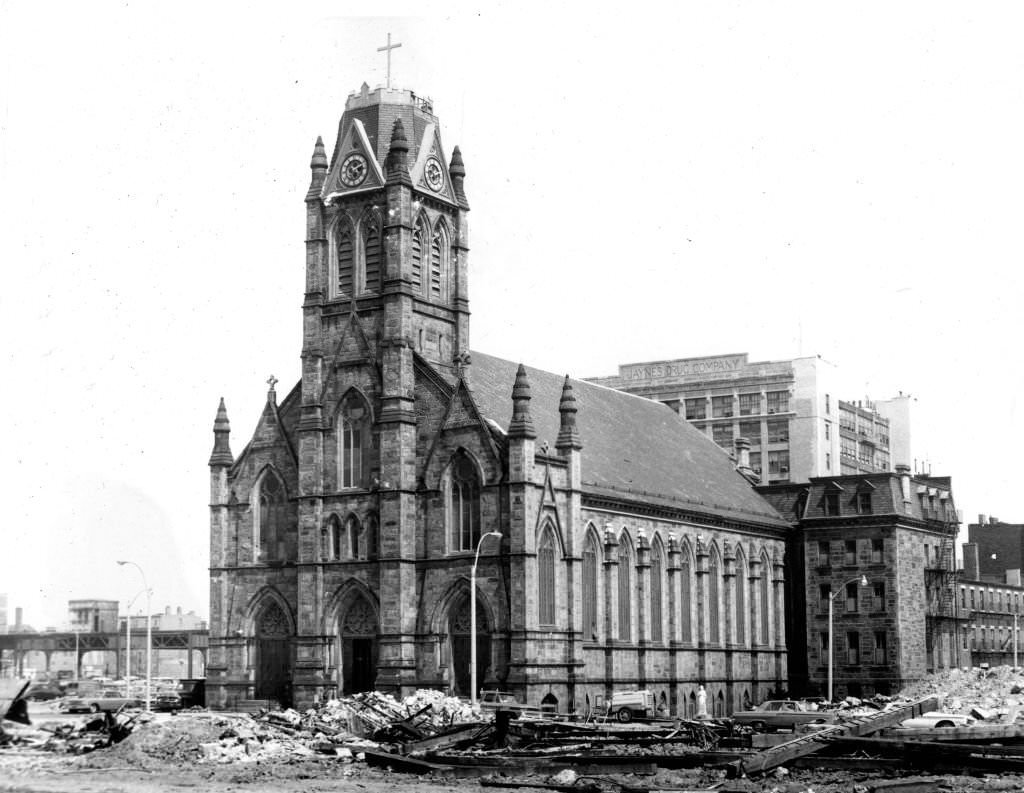#122 The Holy Trinity Church in Boston’s South End Aug. 7, 1964, surrounded by rubble from brick tenement buildings demolished amid area redevelopment.