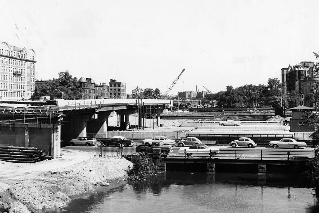 #123 Construction continues on the toll road between Charlesgate East and West in Boston, blocking in part of the Muddy River, on June 15, 1964.
