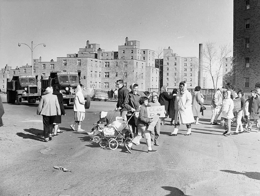 #20 A group of residents from Columbia Point housing project in Boston picket to have the the nearby city and Mile Road Corp.