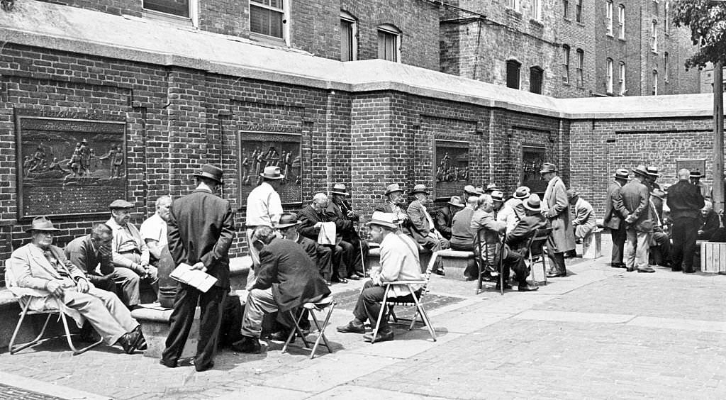 #142 Residents chat and play cards at Boston’s Paul Revere Park in the North End on a sunny May 21, 1963.