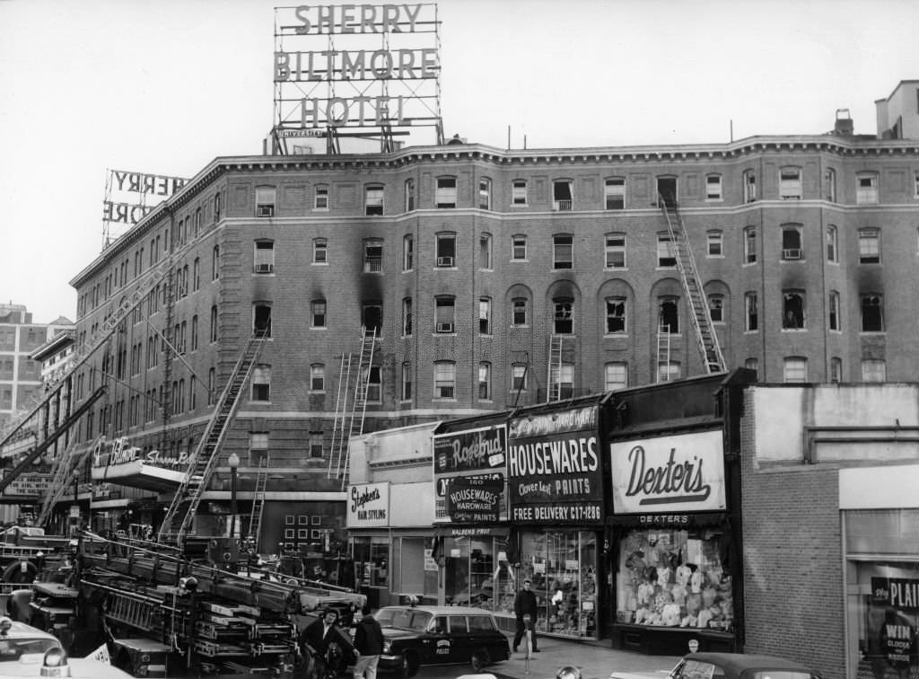#146 Firefighters work to extinguish a five-alarm fire at the Sherry Biltmore Hotel in Boston, March 29, 1963.