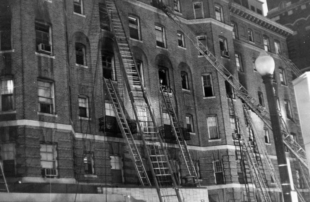 #147 Ladders lean on the side of the Sherry Biltmore Hotel after a five-alarm fire in Boston, March 29, 1963.