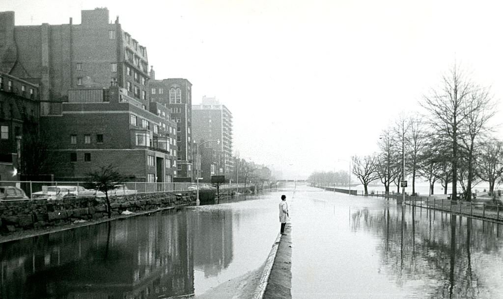#207 This man has no good choices for crossing the street on March 19, 1968, as a surprise spring deluge causes major flooding throughout eastern Massachusetts.