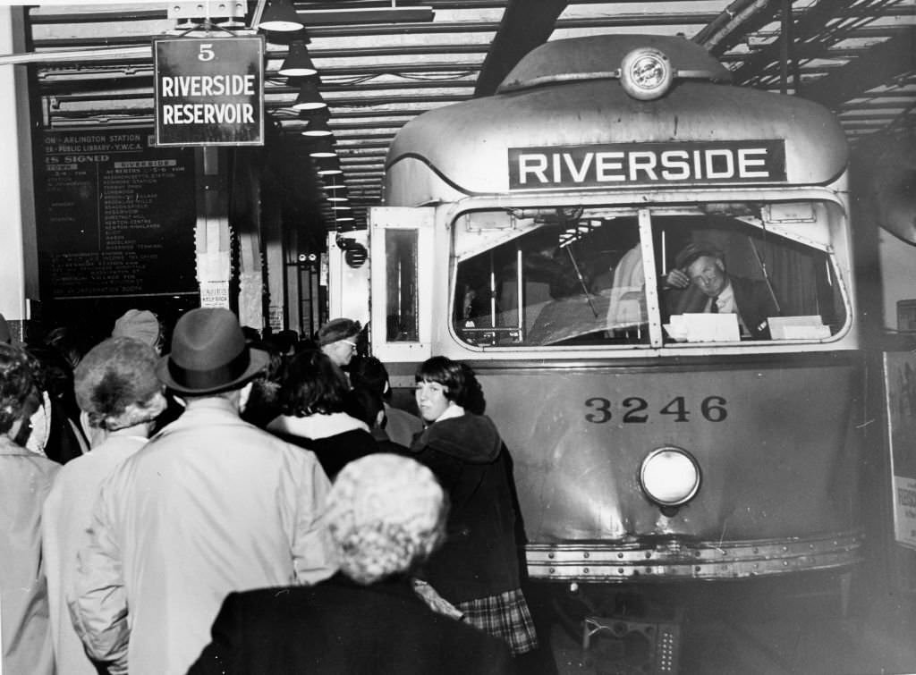 #5 Riders of the MTA’s Highland Branch line crowd aboard a car at Park Street Station in Boston on Oct. 28, 1961.