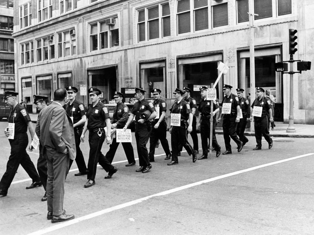 #251 Boston police officers picket along Boylston Street at Arlington Street in Boston, June 16, 1969.