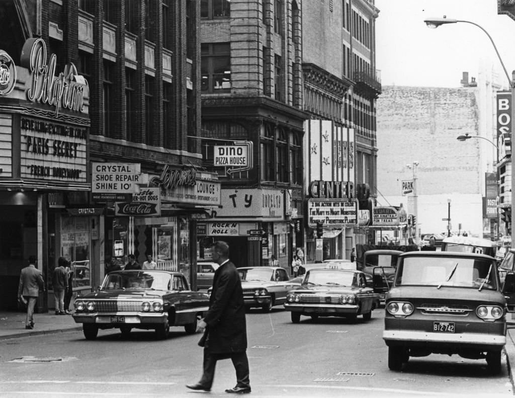 #281 A man crosses Washington Street in the Combat Zone section of Boston circa September 1966.