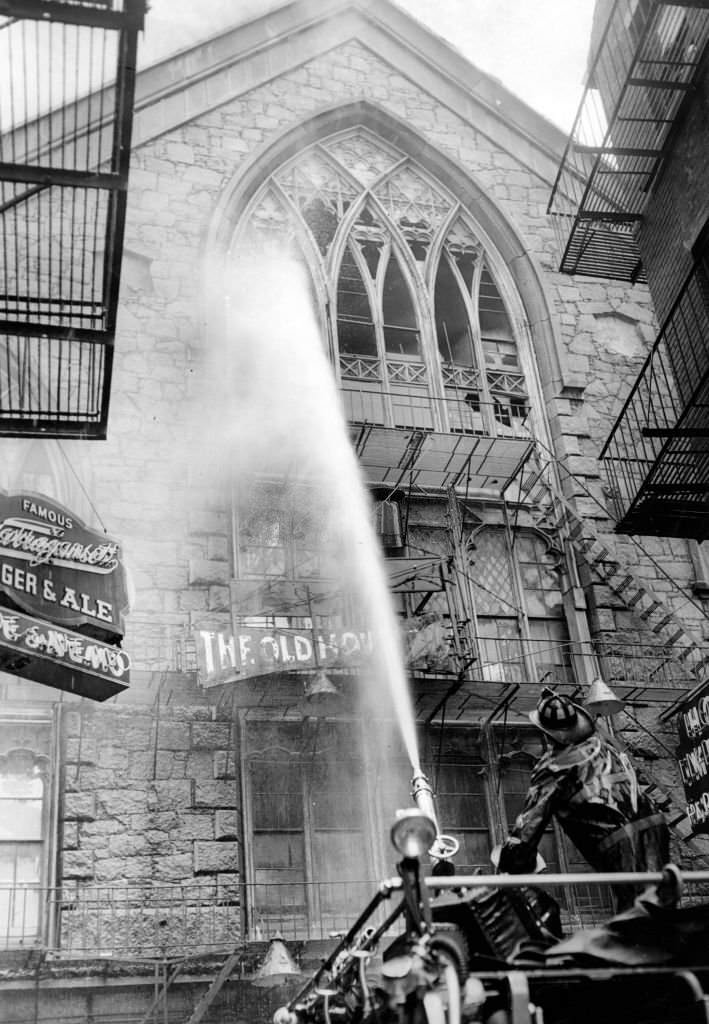 #44 Firefighters battle a blaze at the shuttered Old Howard Theatre in Boston on June 20, 1961.