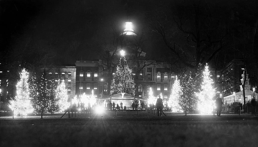 #65 Trees decorated with Christmas festival lights on Boston Common provide a fairyland foreground for the Mass. State House on Nov. 25, 1960. (Photo by Edmund Kelley/The Boston Globe via Getty Images)