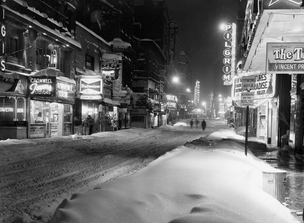 #80 Washington Street in downtown Boston is covered in snow during a snow storm on March 3, 1960.