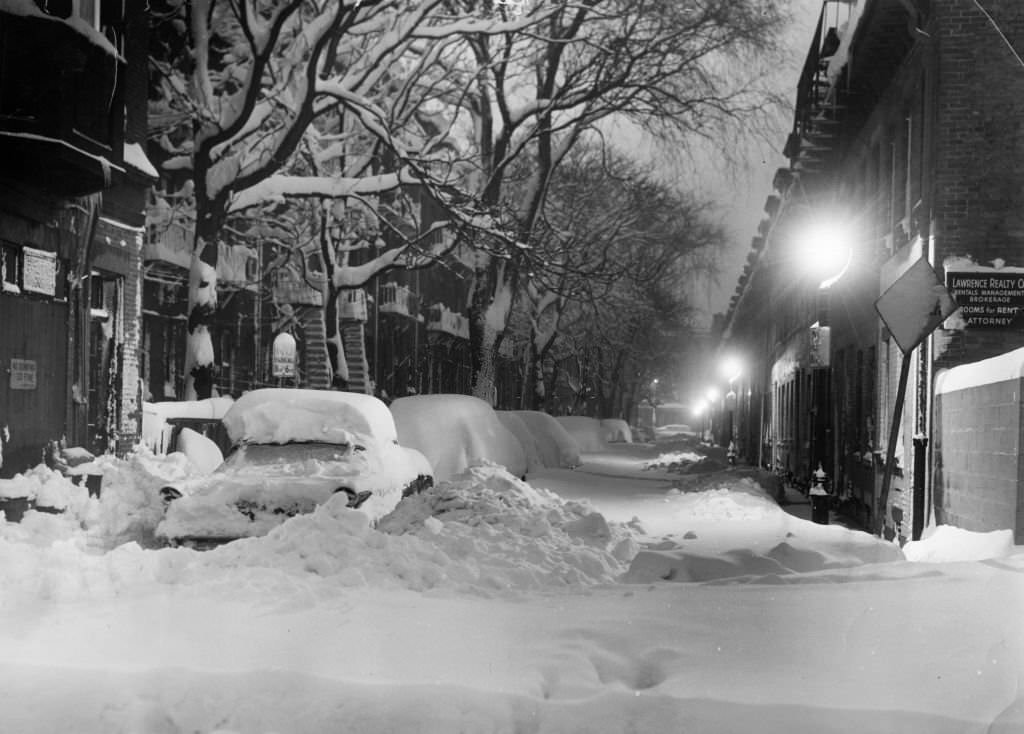 #81 Snow covers a street in the South End of Boston on March 3, 1960.