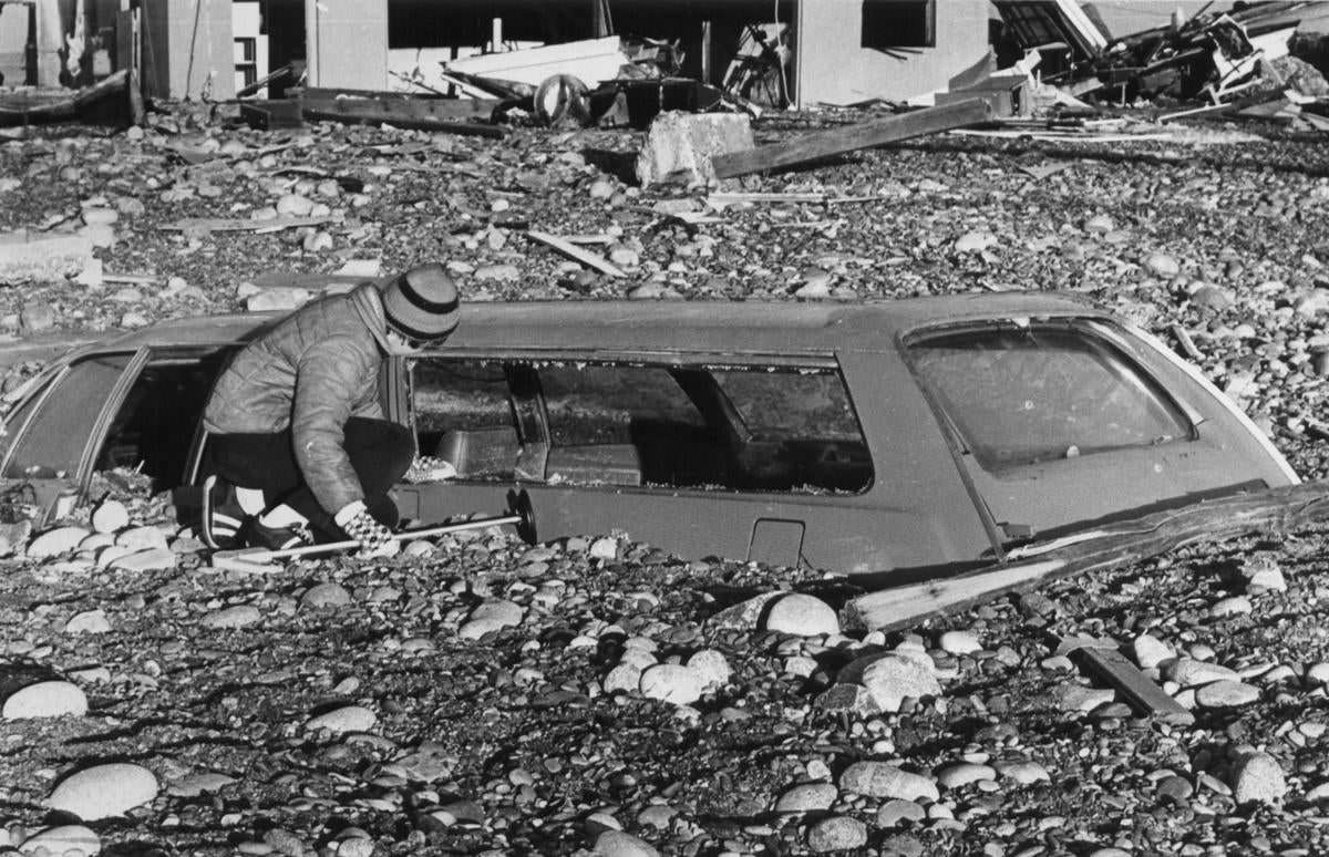 #15 David Rimilty, 14, peered into a car buried in sand on Mass Hill Beach in Scituate on Feb. 9, after the blizzard.