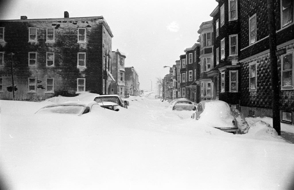 #59 Cars are covered by snow drifts on Washburn Street in Boston on Feb. 7, 1978.