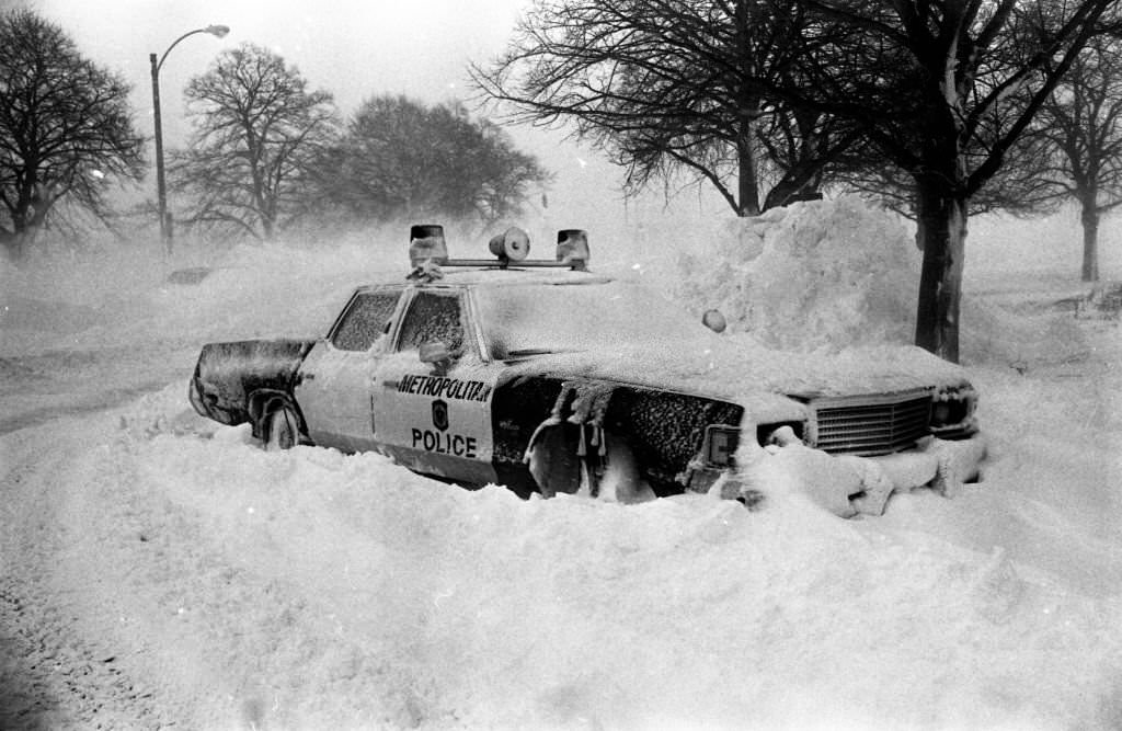 #60 A Metropolitan Police District car is stuck in the snow in Columbia Circle in Boston on Feb. 7, 1978.