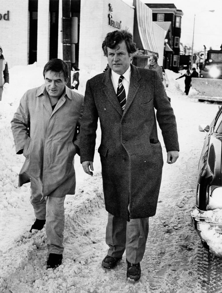 #64 Senator Edward M. Kennedy and an aid, Edward Martin, walk down Broadway after a blizzard in Boston on Feb. 8, 1978.