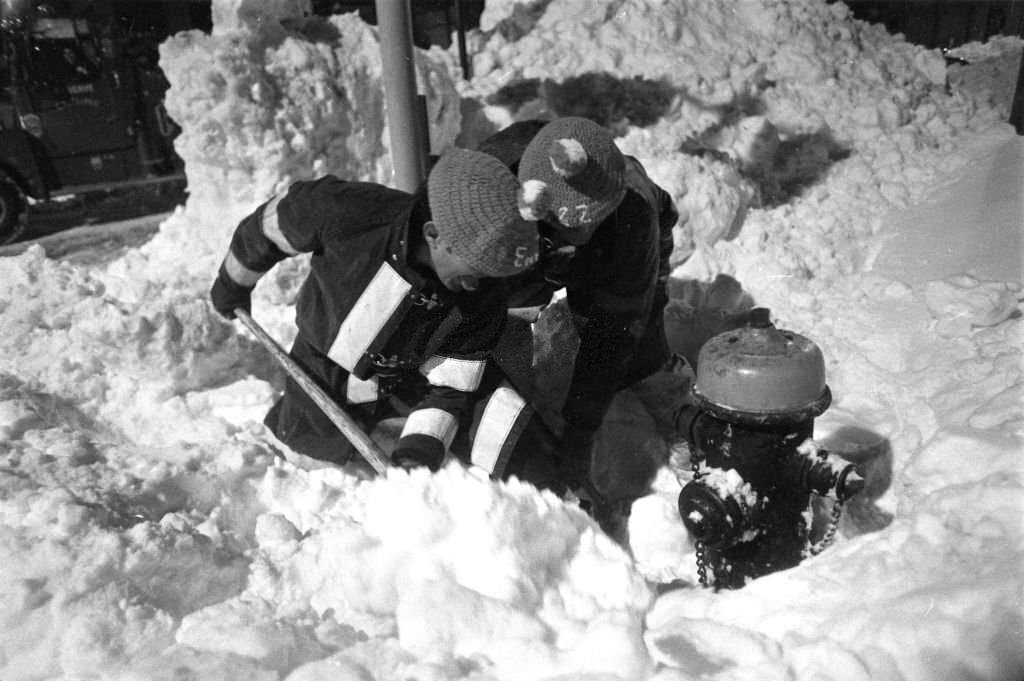 #73 Firefighters Pat Moni and Dick Laureana of Engine 22 dig out a hydrant on Massachusetts Avenue in Boston following the “Blizzard of 78”.
