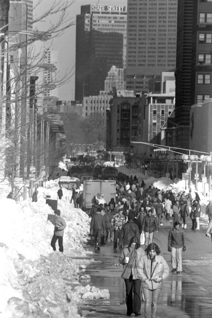 #76 Pedestrians walk up Bolyston Street in Boston in the aftermath of the “Blizzard of 78”.