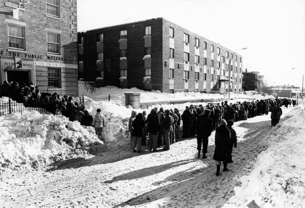 #79 Thousands of people wait for vouchers in the snow on Hancock Street in the Dorchester neighborhood of Boston on Feb. 11, 1978.