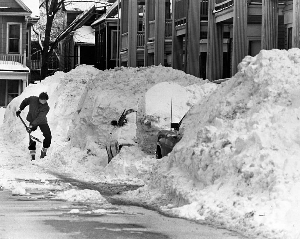 #87 A would-be motorist has his work cut out for him on Hallam Street in Dorchester on March 4, 1978.