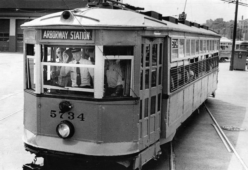 #1 A vintage 1922 orange trolley car, filled with more than 100 transit fans, rides to Park St. Station from the Watertown car barn in Boston.