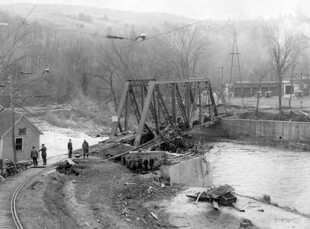 #9 A view of a railroad bridge after a flood swept the area in Springfield, Vt. on Nov. 21, 1927.