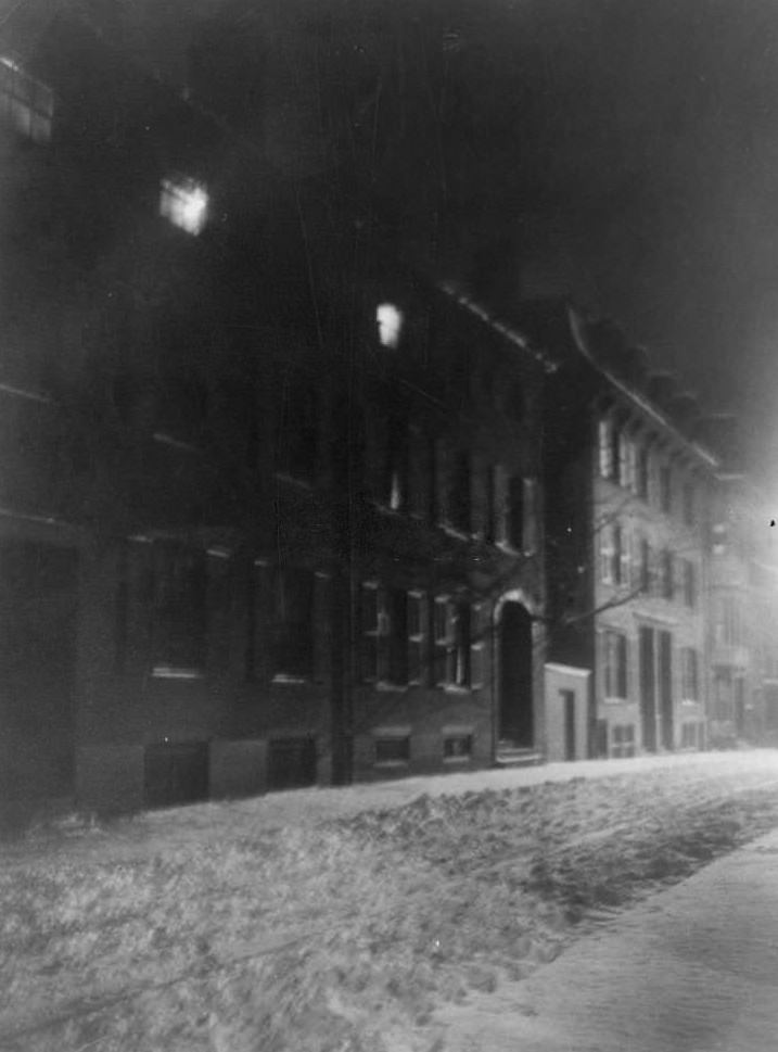 #100 Blurred night view down snowy Pinckney Street, townhouses along left, Boston, Massachusetts, 1906.