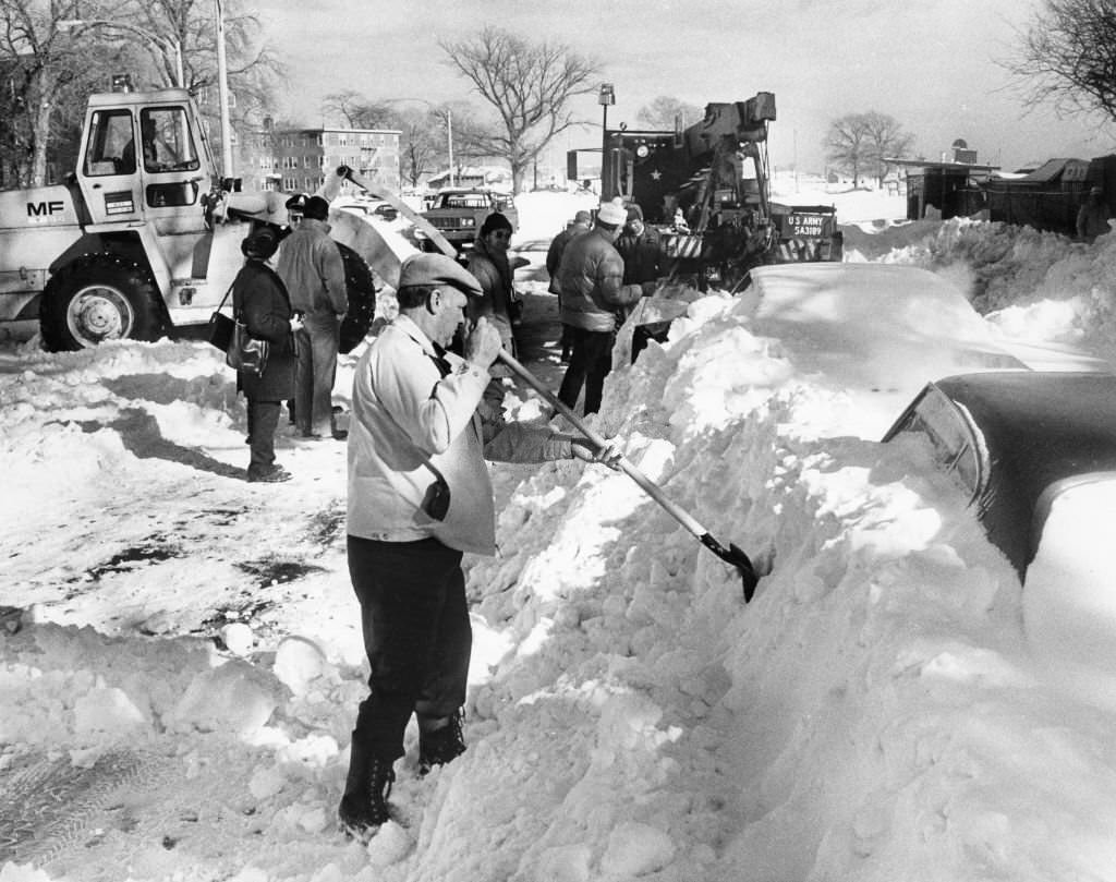 #106 Car owners, MDC workers and the National Guard dig out cars buried in snow on Day Boulevard in South Boston after the “Blizzard of 78”