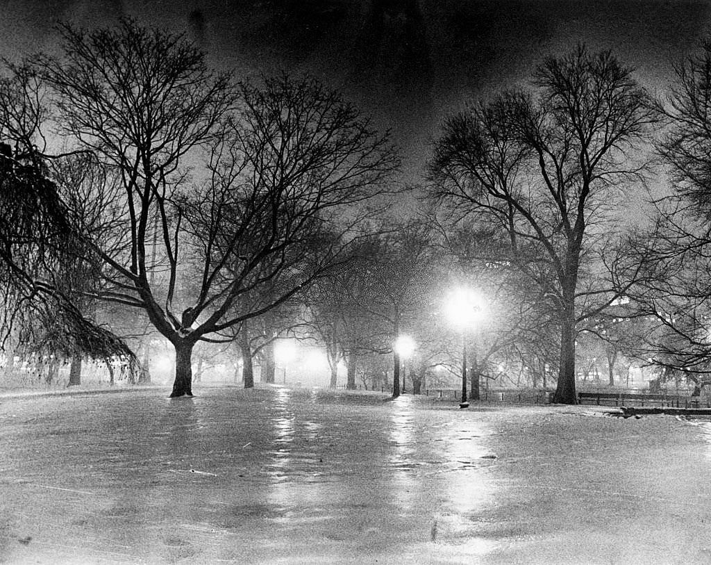 #118 Boston’s Public Garden is covered in snow and ice at night, 1977.
