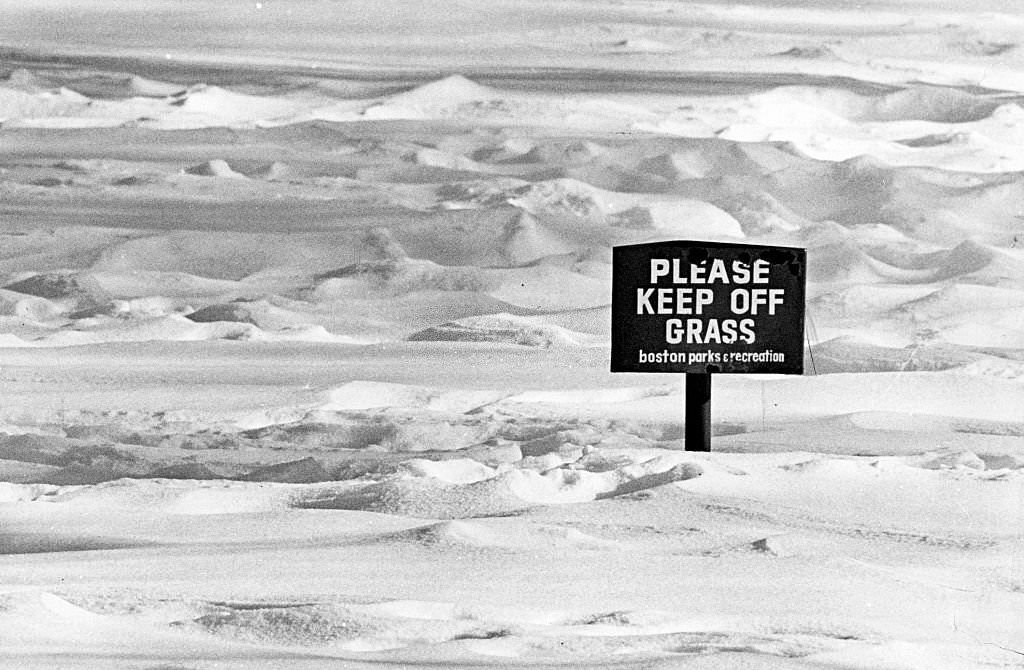 #140 A sign in the snow at Boston’s Public Garden reads, ‘Please keep off the grass’, 1974.