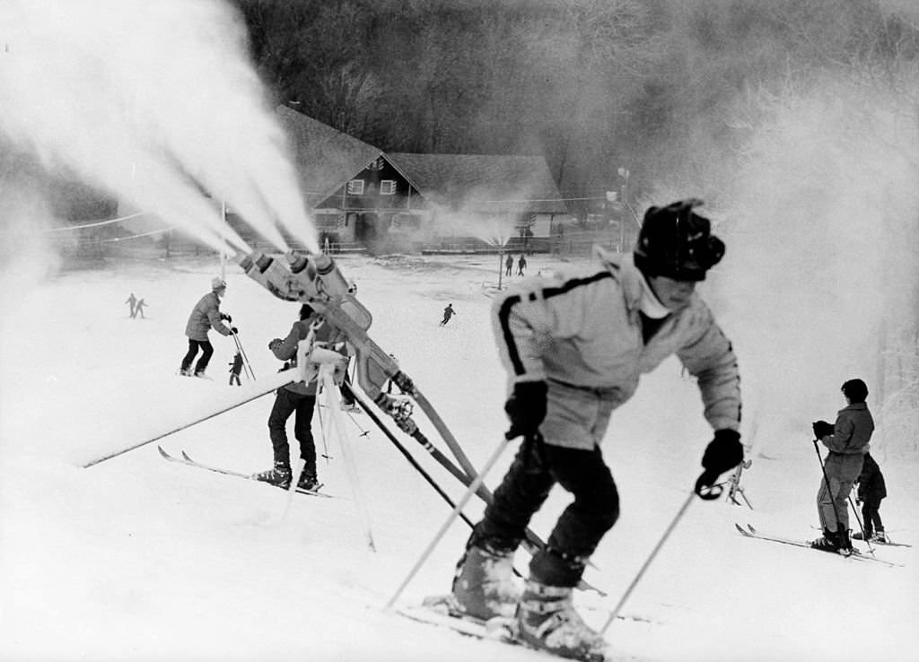 #145 Peoples ski at Blue Hills Ski Area in Canton, 1974. Snow making machines are making snow.