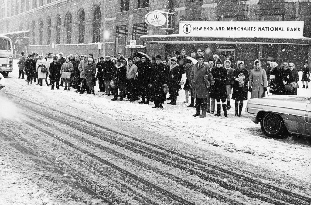 #166 Commuters wait outside South Station in Boston after a snow storm, 1969.
