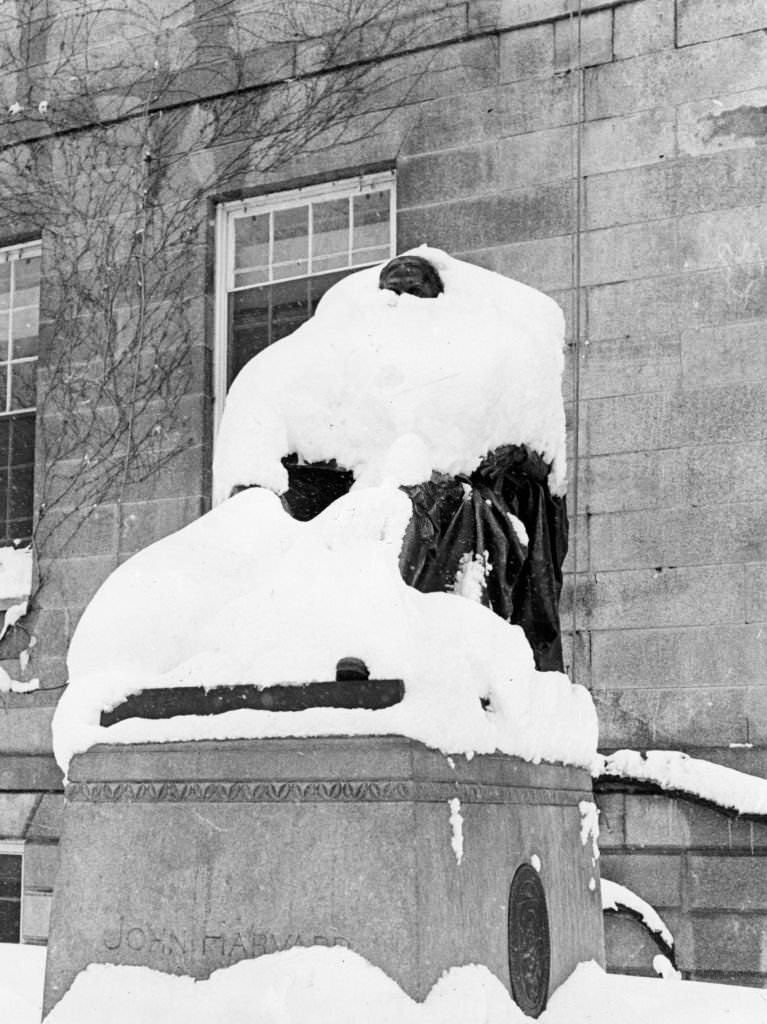 #182 A snow covered John Harvard statue in Harvard Yard at Harvard University in Cambridge, 1969.