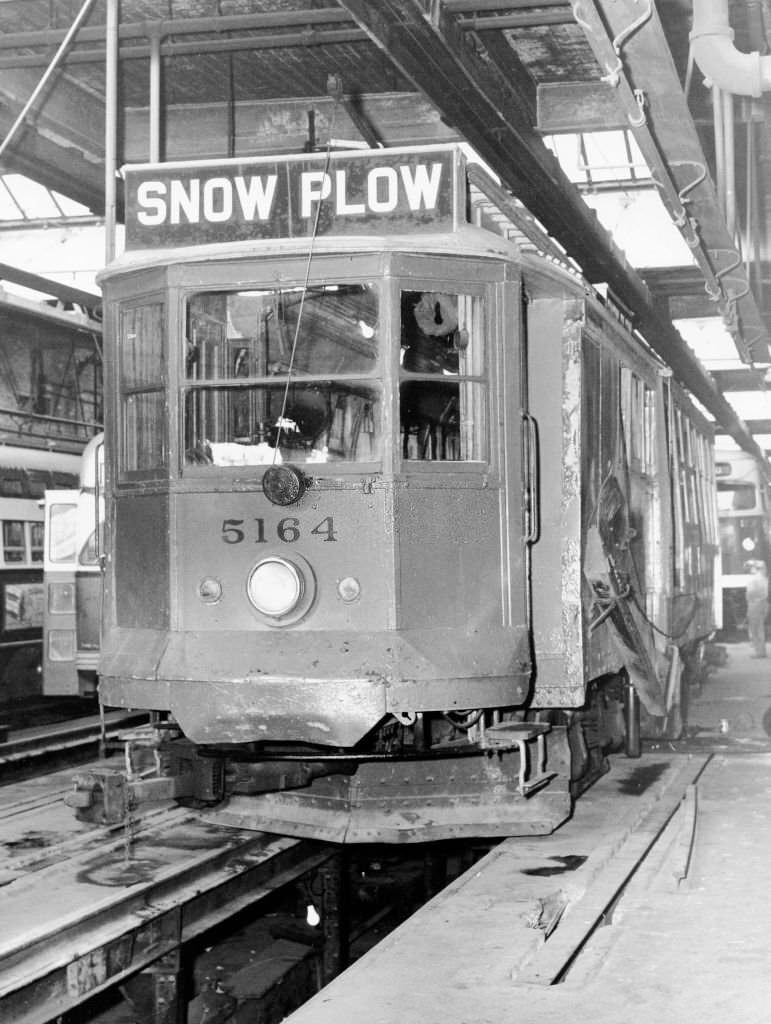 #48 A snow plow car gets ready to go along the tracks on Nov. 23, 1964.