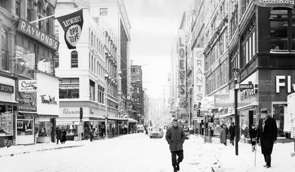 #57 People walk down a snow covered Washington Street in Boston, 1960.