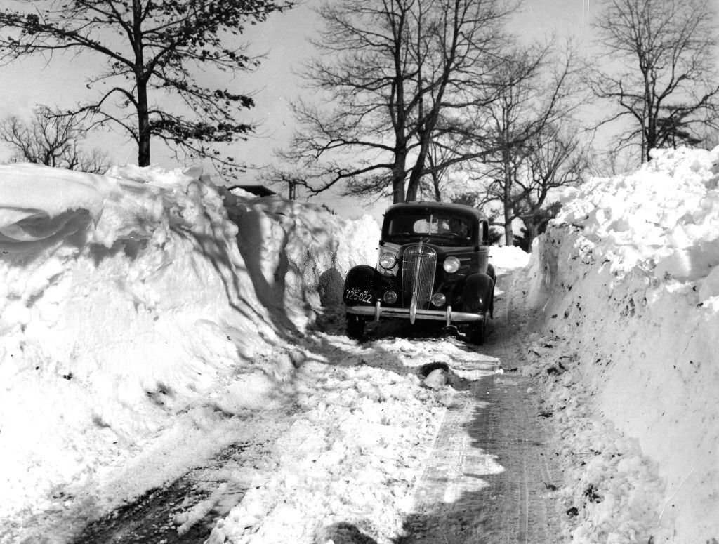 #80 Snow is higher than the tops of cars in places along Route 27 in Medfield, 1940.