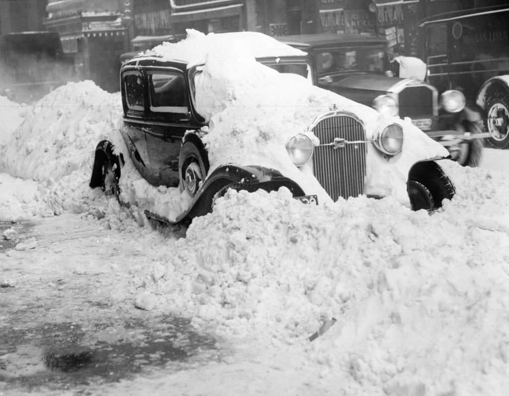 #86 A car is covered in snow in Boston, Jan. 23, 1935.