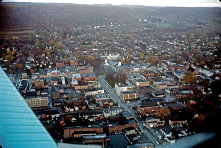 #18 Looking WNW at the center of town from low altitude, October 1962